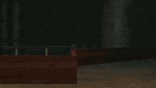 a man and a woman are hugging in a dark room in a video game