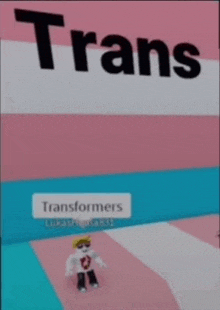 a picture of a person standing in front of a sign that says transformers