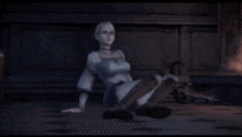 a woman is sitting on the floor with her legs crossed in a dark room .