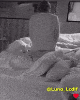 a black and white photo of a bed with the words @luna_lcdif on the bottom