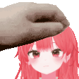 a hand is putting a towel on the head of a girl with red hair .