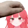 a hand is putting a towel on the head of a girl with red hair .