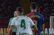 a man in a green jersey with the number 4 on it