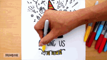 a person is drawing among us on a piece of paper with markers