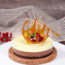 a cake with berries and caramel on top