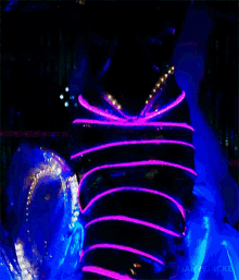 a woman in a glow in the dark costume with the name janeyjacke on the bottom right