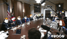 a group of people are sitting around a table with a sign that says 4dood