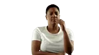a woman in a white shirt is making a funny face with her hand on her chin