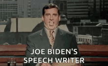 a man in a suit and tie is making a funny face while speaking on a television show .