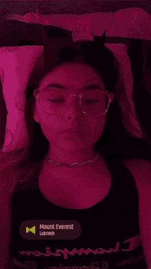 a girl with horns on her head is wearing glasses and a necklace that says mount everest labrrith