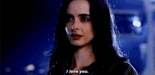a close up of a woman 's face saying " i love you "