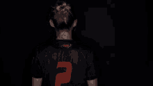 a woman wearing a black shirt that says campbell on it