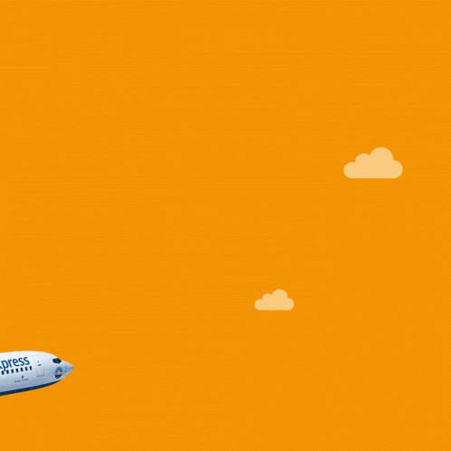 a white and blue airplane taking off up into the sky and through the clouds against an orange sky