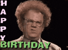 a man with curly hair and glasses says " happy birthday "