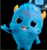 a blue stuffed animal with horns and a tongue out