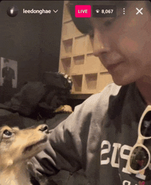 a screenshot of a person playing with a dog with the name leedonghae on the bottom