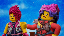 two lego figures are standing next to each other and one has purple hair
