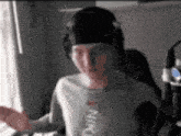a man wearing headphones and a nike shirt