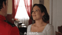 a woman in a white dress says always