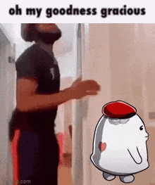 a man is standing next to a cartoon character with a red hat and says `` oh my goodness gracious '' .