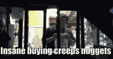 a man in a jail cell with the words insane buying creeps nuggets written above him