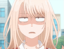 a girl with blonde hair is making a funny face with her eyes closed