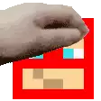 a close up of a person 's hand holding a red block .