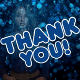 a woman is behind a blue thank you sign
