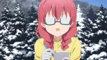 a girl with red hair is wearing glasses and writing on a notepad