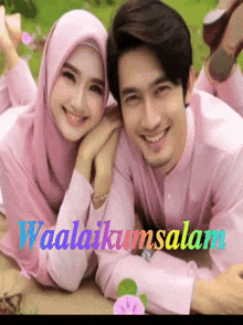 a man and a woman are posing for a picture with the words waalaikumsalam on the bottom right