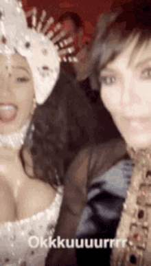 two women are posing for a picture and one of them has a crown on her head