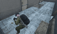 a man with a backpack is kneeling down in a room