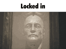 a statue of a man 's head is locked in