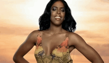 a woman in a plunging neckline dress is smiling