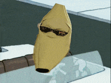 a banana wearing sunglasses is sitting on a table
