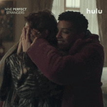 a poster for nine perfect strangers shows two women hugging