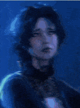 a close up of a person 's face with a glowing eye