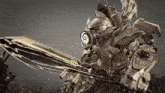 a robot is holding a large sword with a swirl in the middle