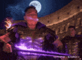 a man in armor is holding a purple sword in front of a full moon