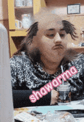 a woman sitting at a table with a straw in her mouth and the word shawarma written on the bottom