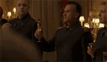 a man and woman are standing next to each other in a room .