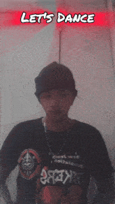 a man wearing a shirt that says let 's dance on it