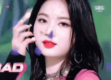a close up of a woman 's face with the word ad in the lower right corner