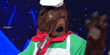 a cartoon character with a chef 's hat and apron