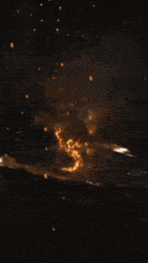 a large explosion in the sky with a few letters visible