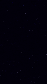 a starry night sky with lots of blue stars on a black background