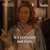 a woman says " it 's certainly not true " in front of a poster for only murders in the building