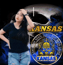 a woman is standing in front of a kansas emblem