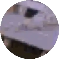 a purple circle with a blurred image of a table and chairs in it