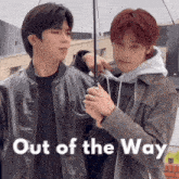 two young men are standing next to each other with the words out of the way written below them